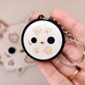 Porte-clés Patsy – dragorn crème à empreintes – accessoire kawaii fait main en France